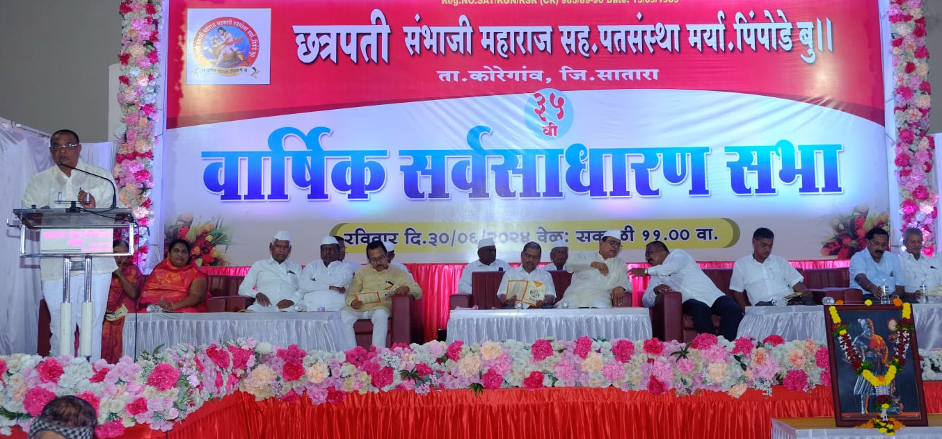 a group of men sitting on a stage