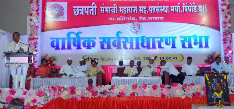 a group of men sitting on a stage